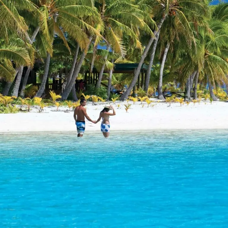Cook Islands Couple at Aitutaki in stunning blue water