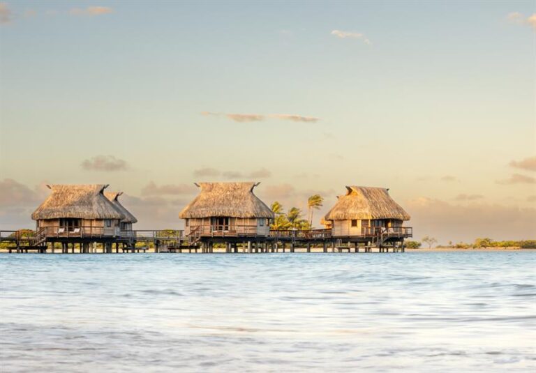 Le Tikehau Overwater Bungalows Golden Hour Lagoon View Tahiti Resorts Island Escapes