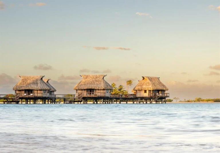 Le Tikehau Overwater Bungalows Golden Hour Lagoon View Tahiti Resorts Island Escapes