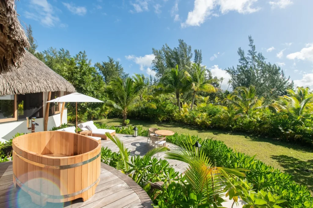 Motu Nao Nao villa deck cedar soaking tub private garden daytimeTahiti Resorts Island Escapes