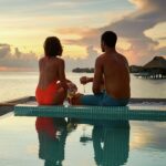 island escapes tahiti conrad bora bora romantic experiences sunset pool water villa