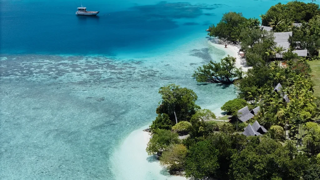 Ratua Island Resort Vanuatu - aerial view resort beach and boat