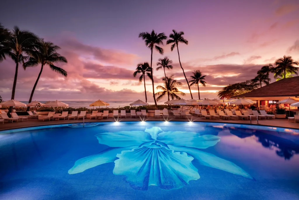 island escapes hawaii holidays halekulani hero pool sunset 01 webp
