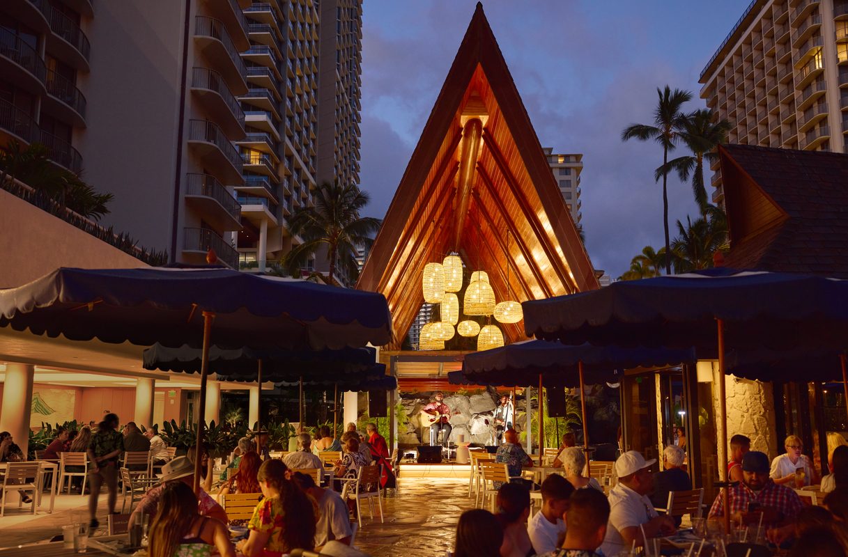 island escapes hawaii holidays outrigger reef waikiki beach resort pool canoe hale night5 ret jpg