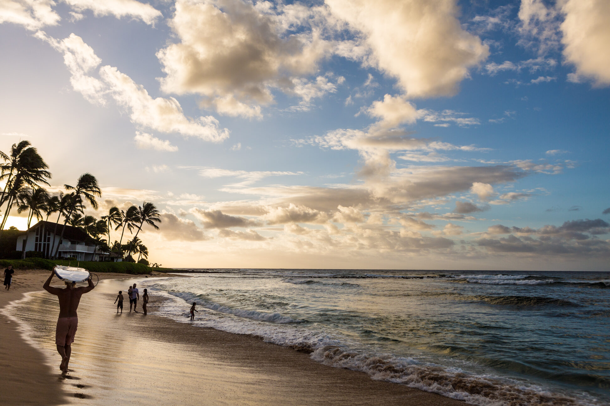surfer and family enjoy sunrise along a koloa beach poipu kauai 13030 jpg