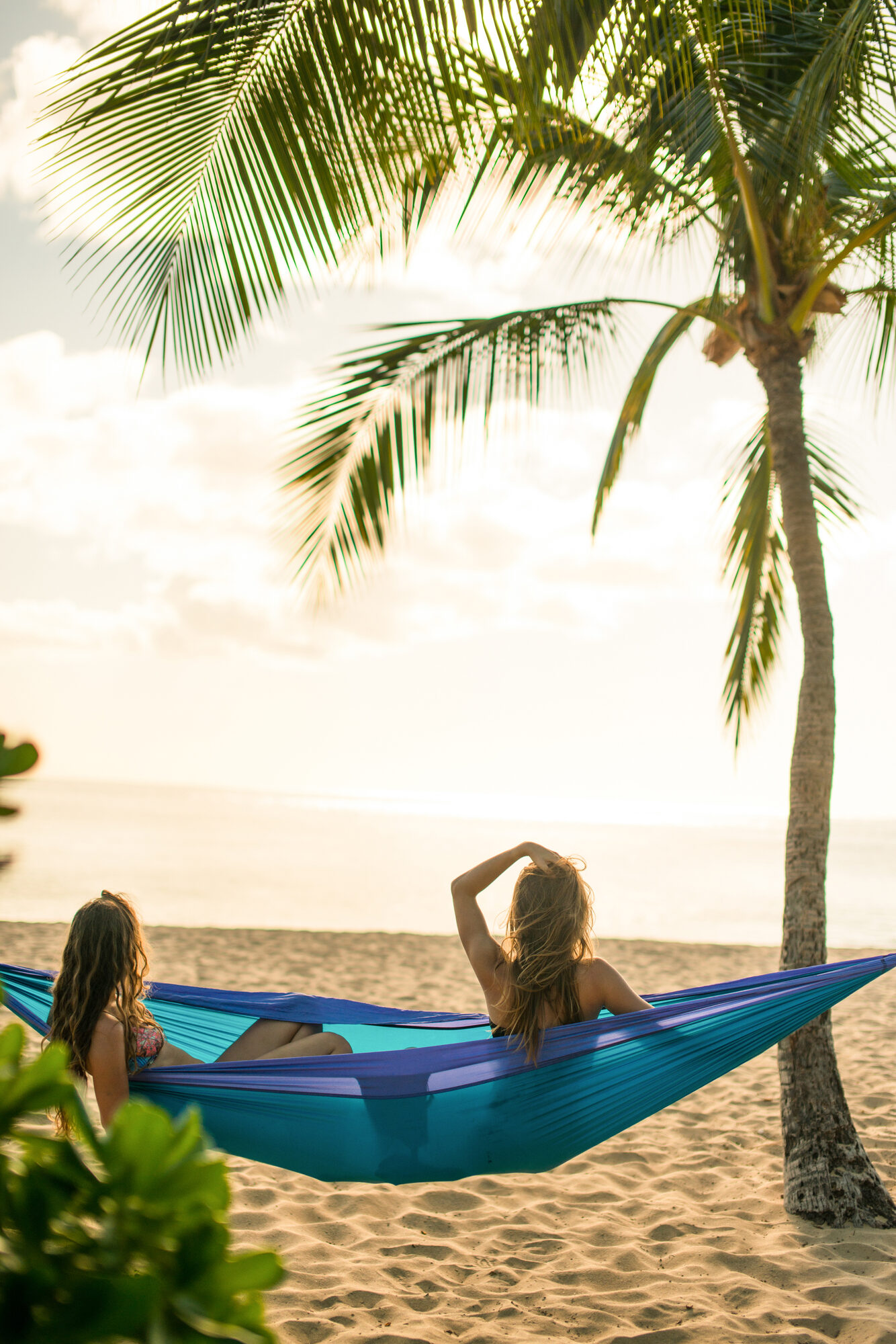 women enjoy lanai sunset from a beachside hammock hulopoe beach park lanai 15744 jpg