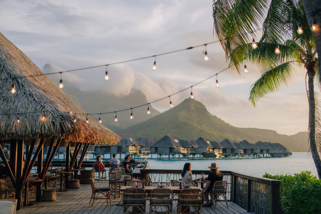 Evening dining at Four Seasons Bora Bora with Mount Otemanu across the lagoon