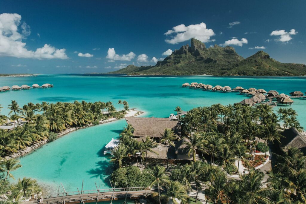 Four Seasons Bora Bora from above, overwater bungalows on Motu Tehotu with Mount Otemanu behind