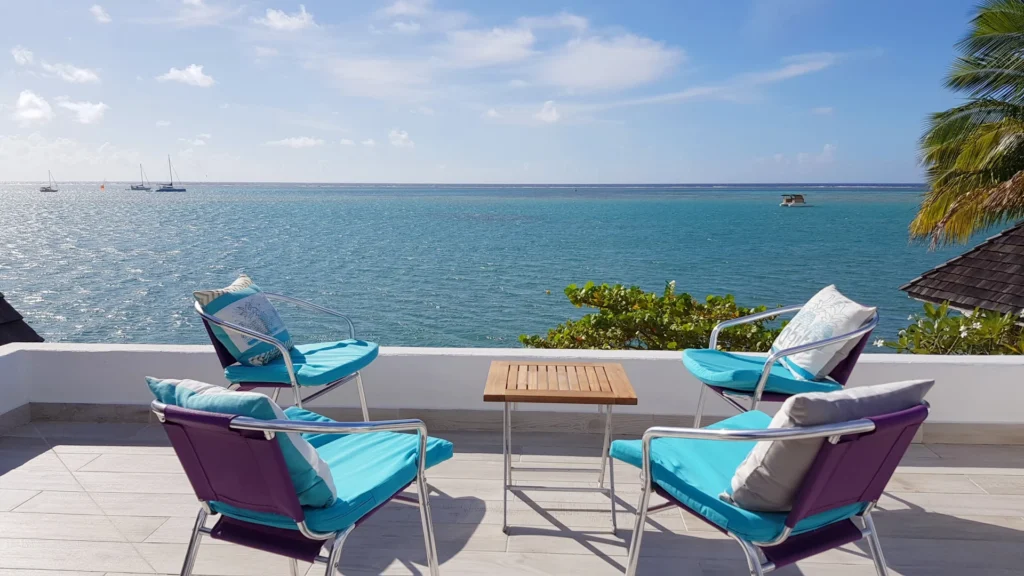 Upper terrace at Villa Vaihau with chairs facing the Moorea lagoon